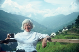 Olga having coffee with Himalaya in background